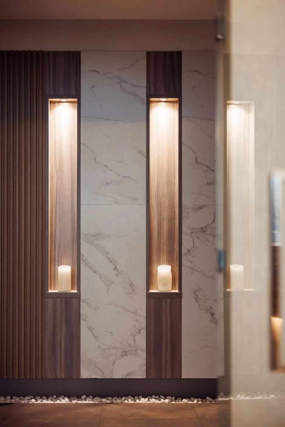 Lit marble doorway leading to the treatment rooms at the DIFC branch