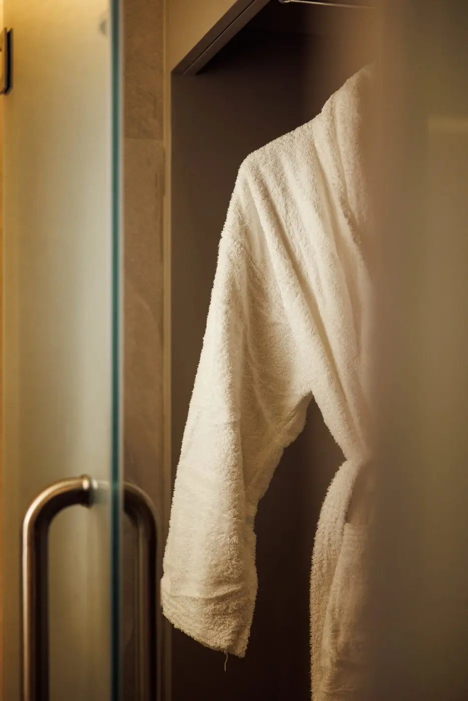 Bathrobe hanging by the shower in the DIFC treatment room