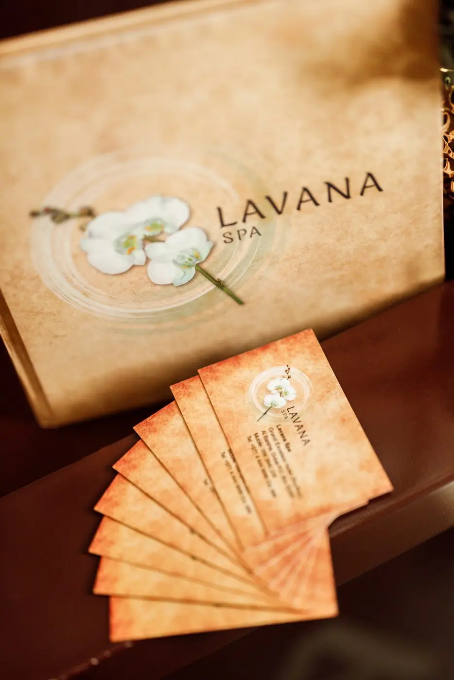 Lavana Spa gift vouchers laid out on a wooden board at Al Barsha